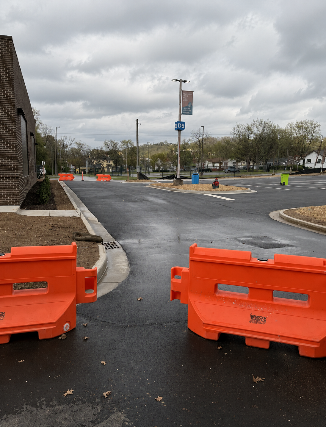 After: clean black asphalt parking lot